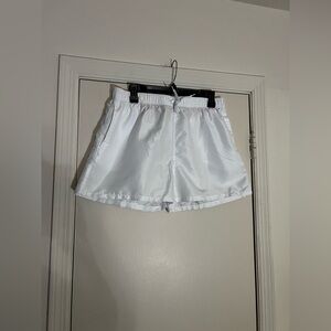 White swim trunks 
Size Medium
In great condition